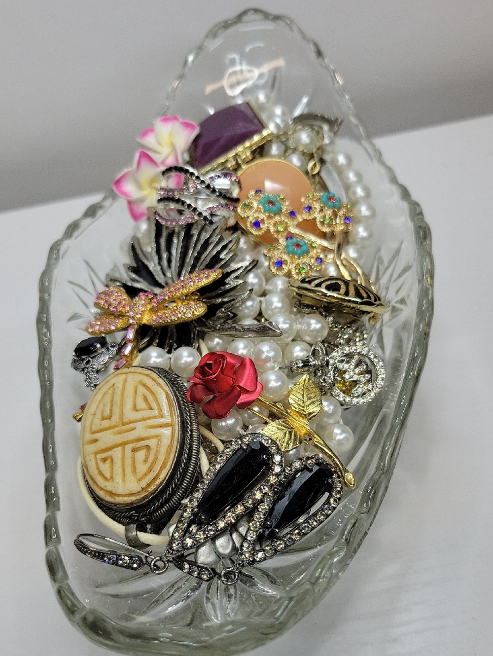 Glass Dish Filled With Jewelry